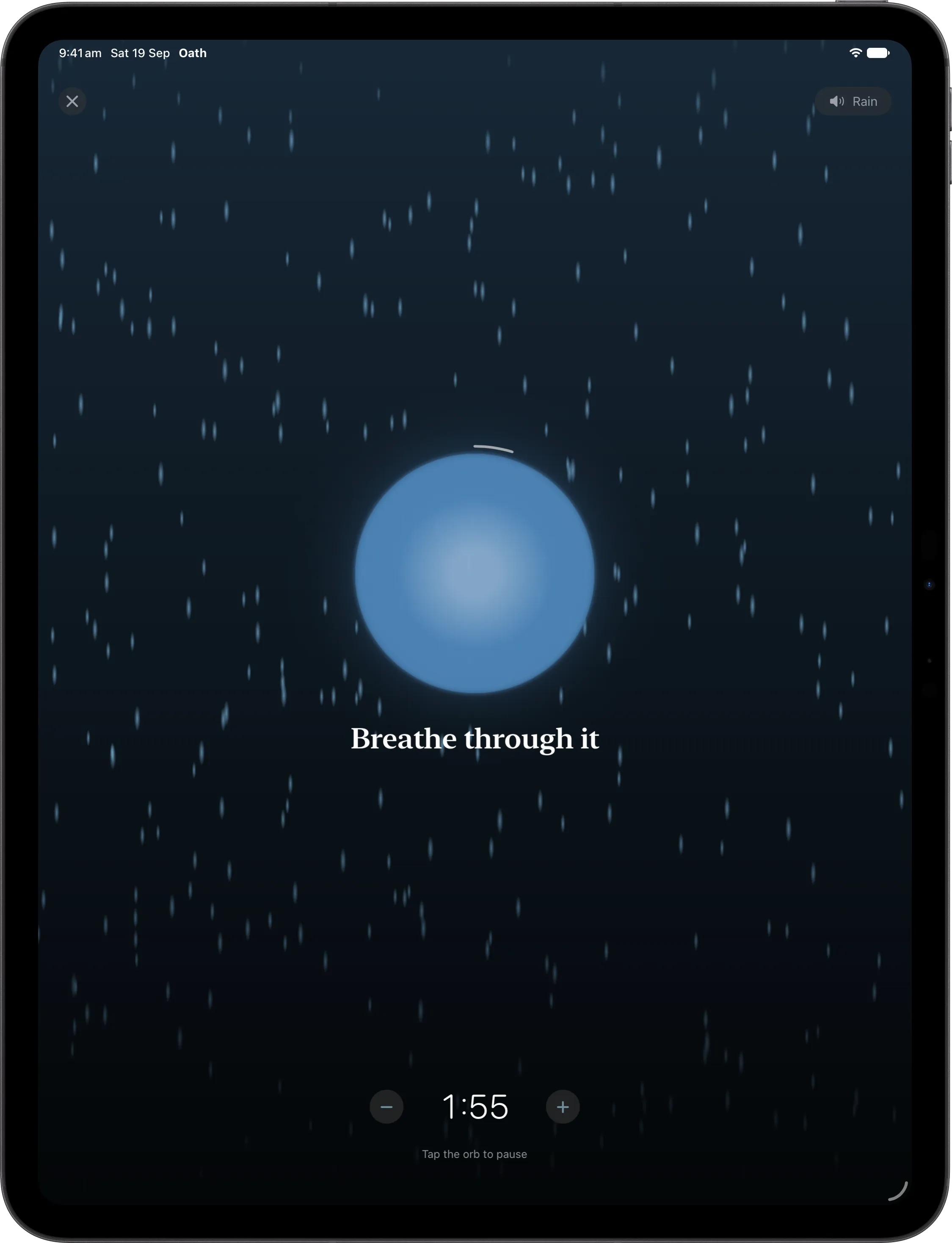 A plunge on iPad, rain falling behind the glowing orb