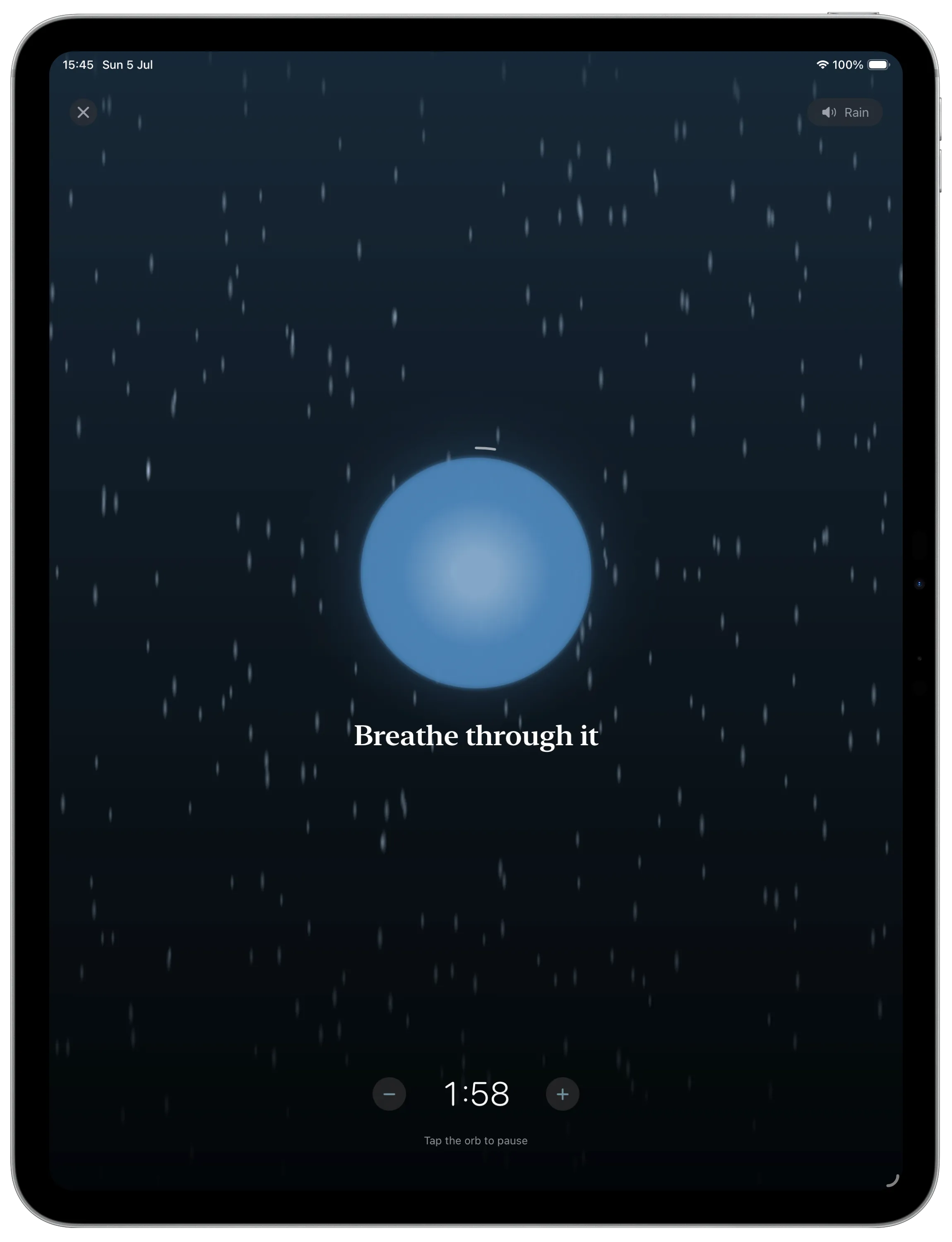 A breathing session on iPad with rain falling behind the orb